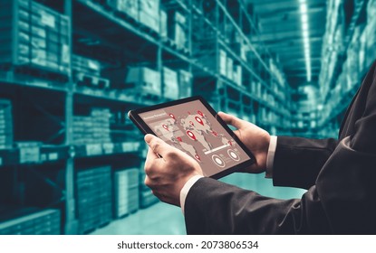 Warehouse management innovative software in computer for real time monitoring of goods package delivery . Computer screen showing smart inventory dashboard for storage and supply chain distribution .