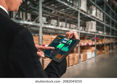 Warehouse management innovative software in computer for real time monitoring of goods package delivery . Computer screen showing smart inventory dashboard for storage and supply chain distribution .