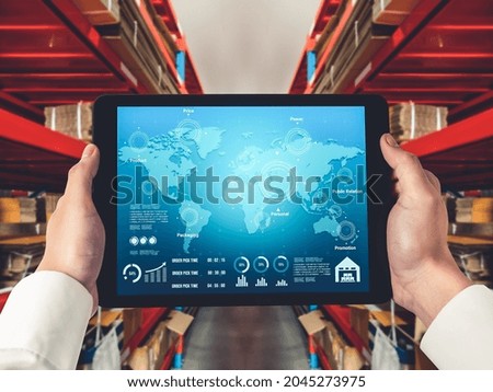 Warehouse management innovative software in computer for real time monitoring of goods package delivery . Computer screen showing smart inventory dashboard for storage and supply chain distribution .