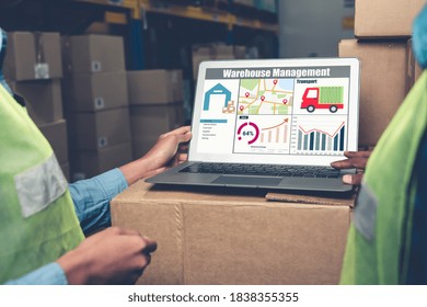 Warehouse management software application in computer for real time monitoring of goods package delivery . PC screen showing smart inventory dashboard for storage and supply chain distribution .