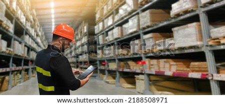 warehouse management system. Man Worker hands holding tablet on warehouse logistic network distribution and smart transportation Logistic import export and industry.