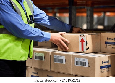 Warehouse, manager and box with stock, label and package for logistics and cargo export. Person, freight and inventory for shipping, ecommerce or wholesale supplier with courier inspection for retail - Powered by Shutterstock