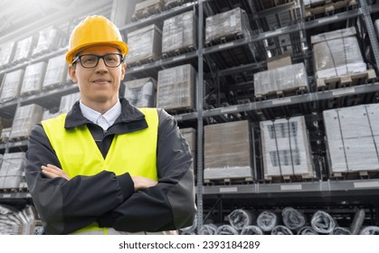 Warehouse manager looking at the camera