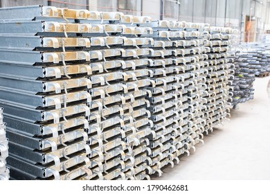 Warehouse Of Metal Products. Part Of The Flooring For Construction Of The Rafters Stacked In The Same Stack