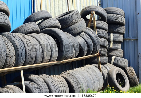 Warehouse of old tires in\
the repair shop