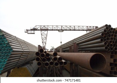 Warehouse of pipes of different diameters on the street