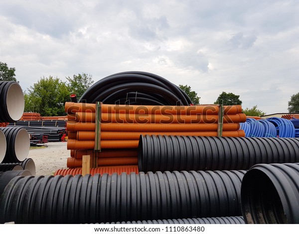A warehouse\
of plastic pipes for various purposes, diameter and color under the\
open sky. Manufacture and sale of plastic products for construction\
works. Drainage and sewerage.\
