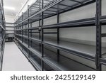 Warehouse racks storage metal pallet racking system in warehouse. Modern interior of new empty warehouse. The shelves are pallet racks. Metal structure. Storage equipment.