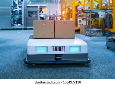 Warehouse Robot Car Carries Cardboard Box Assembly In Factory