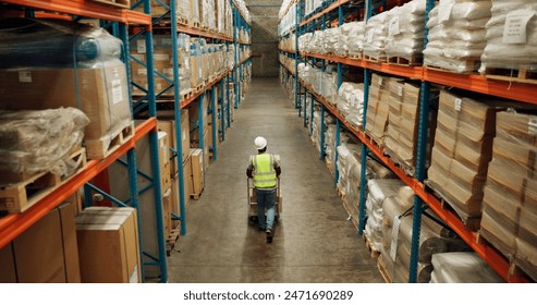 Warehouse, shipping and man walking in a distribution, freight and supply chain company. Worker, contractor and back with stock, factory and export business with employee working with storage - Powered by Shutterstock