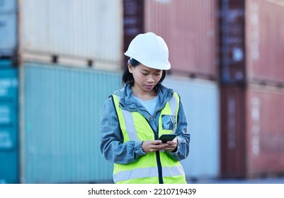 Warehouse, Shipping And Manager On A Phone At Factory Plant, Text And Check Delivery Checklist And Stock On Online App. Cargo, Logistics And Supply Chain Management By Asian Woman Control Inventory