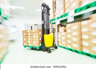 Warehouse Stacker Loader Truck At Work