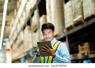 Warehouse staff check stock, inventory, stock control and warehouse management. logistics concept factory business export industry. - Powered by Shutterstock