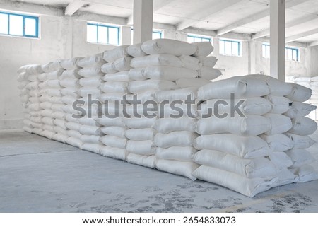 Warehouse storing large quantities of wheat flour bags ready for distribution in a clean and organized space
