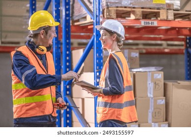 Warehouse supervisor collaborates with staff members, discussing tasks on tablet. Focusing on planning and coordinating activities to ensure efficient operations and effective inventory management. - Powered by Shutterstock