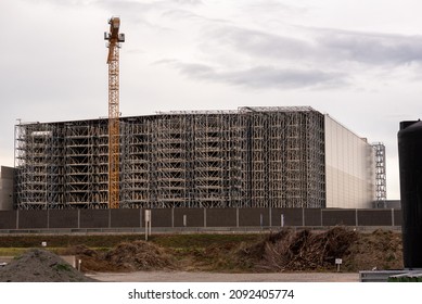 Warehouse Under Construction Without External Wall. Metal Shelves Of A Future Logistics Center.