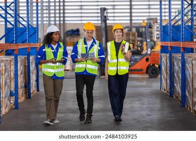 Warehouse worker chatting walk around and inspect working logistics. factory industry supervisor manufacture. warehouse person employee talking plan inspect in storehouse. - Powered by Shutterstock