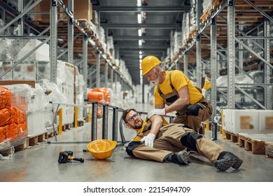 Warehouse Worker Falling Down Before Trying To Pick Up Heavy Cardboard Box From The Shelf. Hard Injury At Work.