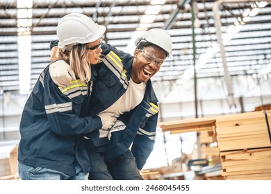 Warehouse worker man person has work related accident falls while trying to pick up wooden panel from the Shelf. colleagues call for help and medical assistance, injury and heal accident insurance - Powered by Shutterstock