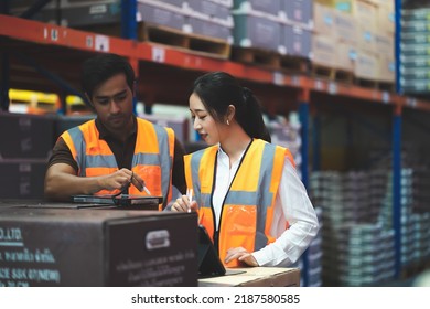 Warehouse Worker And Manager Checks Stock And Inventory With Digital Tablet Computer In The Retail Warehouse Full Of Shelves With Goods. Working In Logistics, Distribution Center.