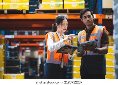 Warehouse worker and manager checks stock and inventory with using digital tablet computer in the retail warehouse full of shelves with goods. Working in logistics, Distribution center. - Shutterstock ID 2190912287