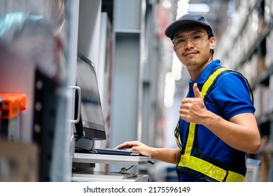 Warehouse Worker In Safety Suite Thumbs Up While Working With Computer To Record Data The Stock Inventory In Large Warehouses, Good Service, Supply Chain, Logistic Network Technology Concept.