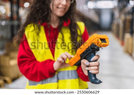 Warehouse worker scanning barcodes on products, ensuring efficient inventory management within a distribution center