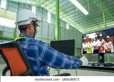 Warehouse worker talk brainstorm on video call on computer with diverse colleagues in a large warehouse. - Shutterstock ID 1806380071