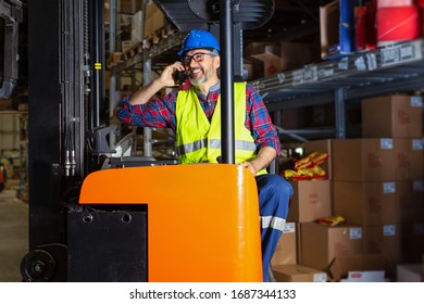 Warehouse Worker Talking On The Phone .