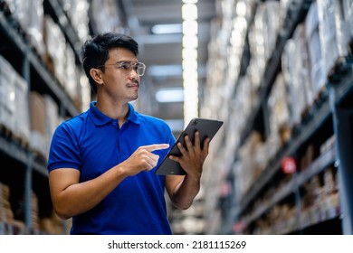 Warehouse Worker using digital tablets to check the stock inventory in large warehouses, a Smart warehouse management system, supply chain and logistic network technology concept. - Powered by Shutterstock