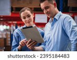 Warehouse worker working and checking the stock in the warehouse. Factory manager using digital tablet check barcode in industry factory logistic.