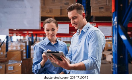 Warehouse worker working and checking the stock in the warehouse. 
Factory manager using digital tablet check barcode in industry factory logistic. - Powered by Shutterstock