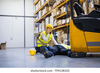 Warehouse workers after an accident in a warehouse.