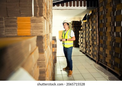 Warehouse Workers Checking Stock In A Large Warehouse In A Large Warehouse.