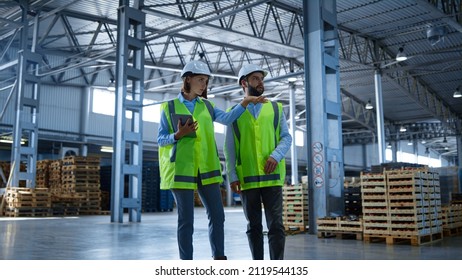 Warehouse workers tablet information check collecting info about production. Factory employees in green uniform checking supply export shipment discussing. Manufacture storehouse occupation concept - Powered by Shutterstock