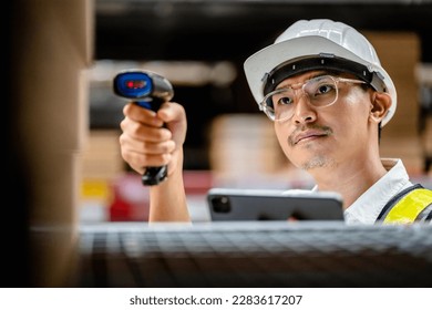 Warehouse workers use scanner checking and scan the barcode of stock inventory to keep storage in a system, Smart warehouse management system, Supply chain and logistic network technology concept.