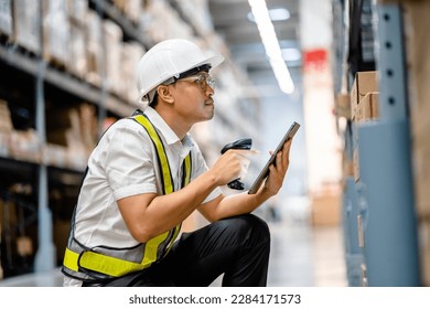 Warehouse workers use scanner checking and scan the barcode of stock inventory to keep storage in a system, Smart warehouse management system, Supply chain and logistic network technology concept. - Powered by Shutterstock