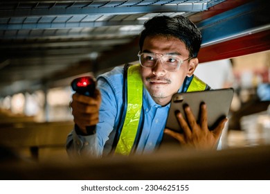 Warehouse workers use scanner checking and scan the barcode of stock inventory to keep storage in a system, Smart warehouse management system, Supply chain and logistic network technology concept.