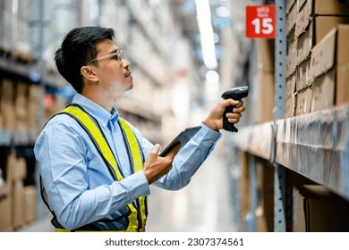 Warehouse workers use scanner checking and scan the barcode of stock inventory to keep storage in a system, Smart warehouse management system, Supply chain and logistic network technology concept.