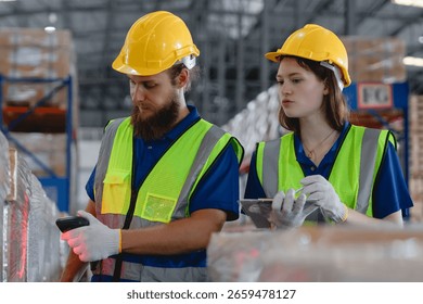 Warehouse workers using barcode scanner and tablet to check inventory in a logistics center, demonstrating coordination, technology use, and real-time data entry.