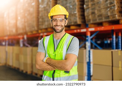 Warehouse workers using a digital tablet while recording inventory. Logistics employees working with warehouse management software in a large distribution centre.