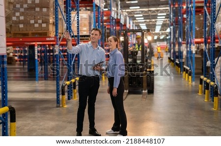 Warehouse workers are walking customers, checking products, arrangements, new arrivals of additional items in the warehouse department. Employees who organize the distribution of goods to the market.