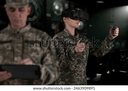 Warfare pilot using head-mounted displays VR glasses, digital device operating with robot, drone or troops of mechanical soldiers. The military's training virtual simulators, AI technology in the army