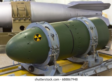 A warhead on a transport stand, against a rocket. Weapons of mass destruction. Nuclear weapons, chemical weapons, a bomb.