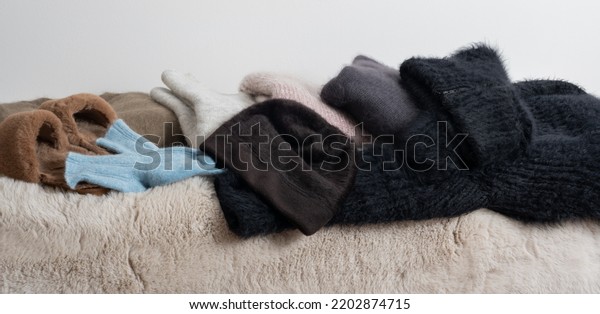 Warm accessory winter sweater, socks, hat\
and fur slippers for the cold winter\
season