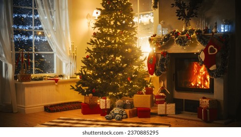 Warm Atmosphere on a Winter Snowy Night: Empty Shot of Home Interior with Fireplace Decorated with Christmas Tree, Gifts, Ornaments, Garlands and Stockings. Magical Time of a Holiday Full of Happiness - Powered by Shutterstock