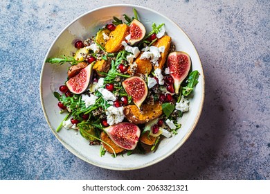 Warm Autumn Quinoa Salad With Baked Vegetables (sweet Potato, Brussels Sprouts), Figs, Feta Cheese And Pomegranate, Top View.