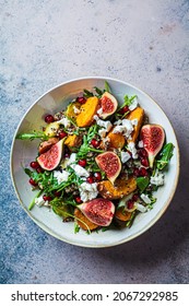 Warm Autumn Quinoa Salad With Baked Vegetables (sweet Potato, Brussels Sprouts), Figs, Feta Cheese And Pomegranate, Top View.