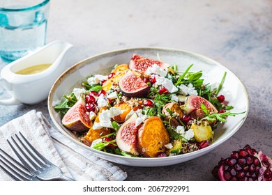 Warm Autumn Quinoa Salad With Baked Vegetables (sweet Potato, Brussels Sprouts), Figs, Feta Cheese And Pomegranate.