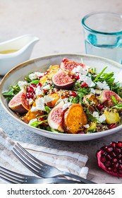 Warm Autumn Quinoa Salad With Baked Vegetables (sweet Potato, Brussels Sprouts), Figs, Feta Cheese And Pomegranate.